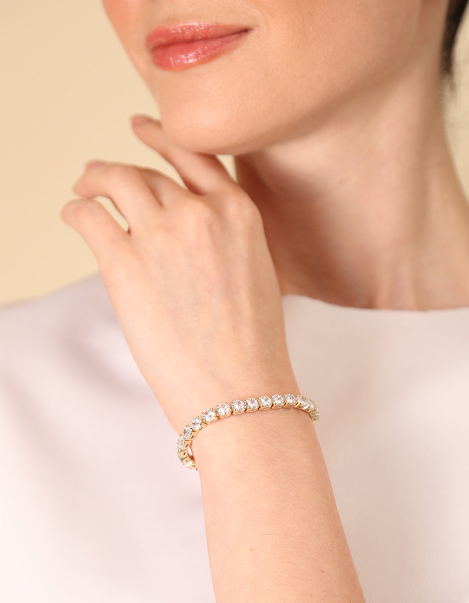 ⚡Ei Pulsera en Plata .925 con Baño de Oro 22 kt y Topacios Blancos en Forma Redonda