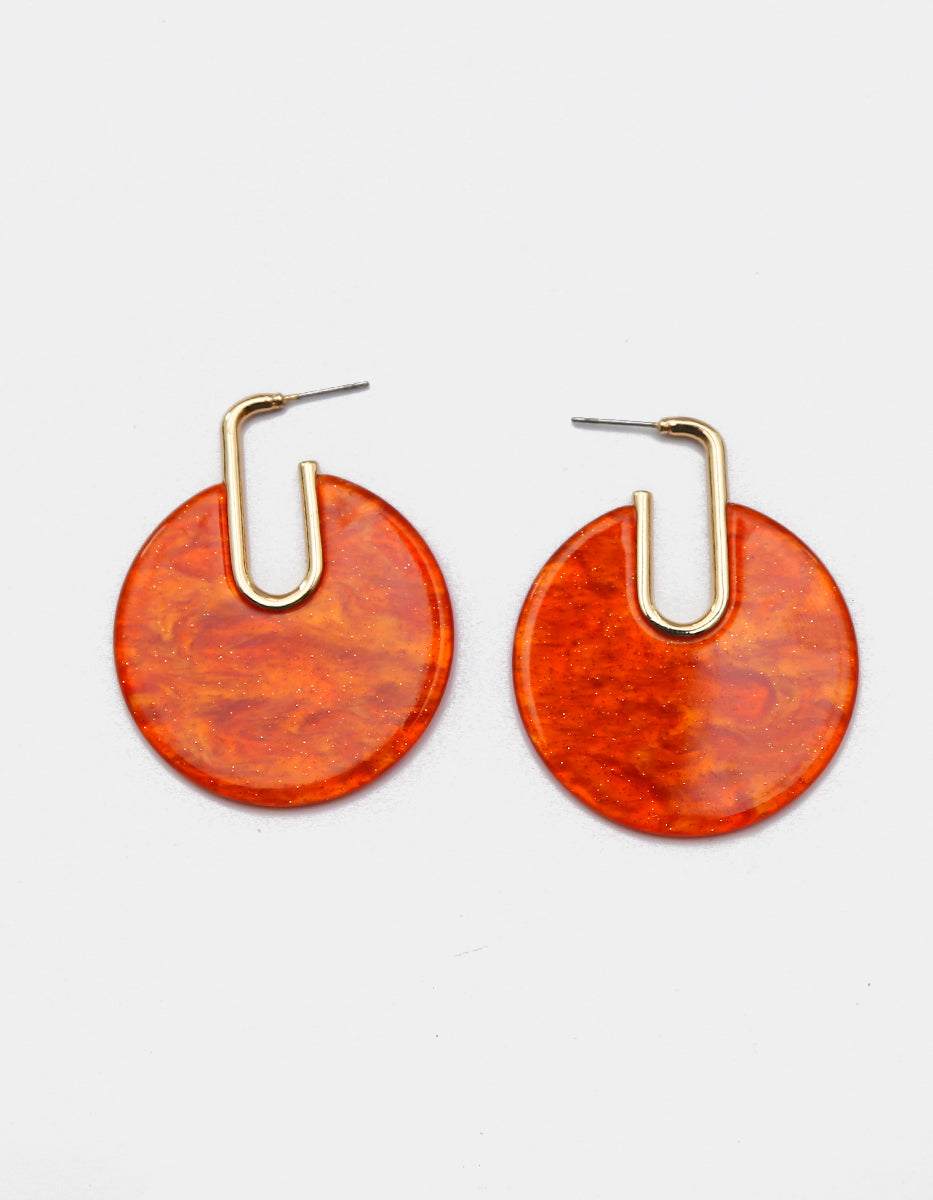 Aretes en bronce con baño de oro de 22kt y disco circular en baquelita ámbar terracota