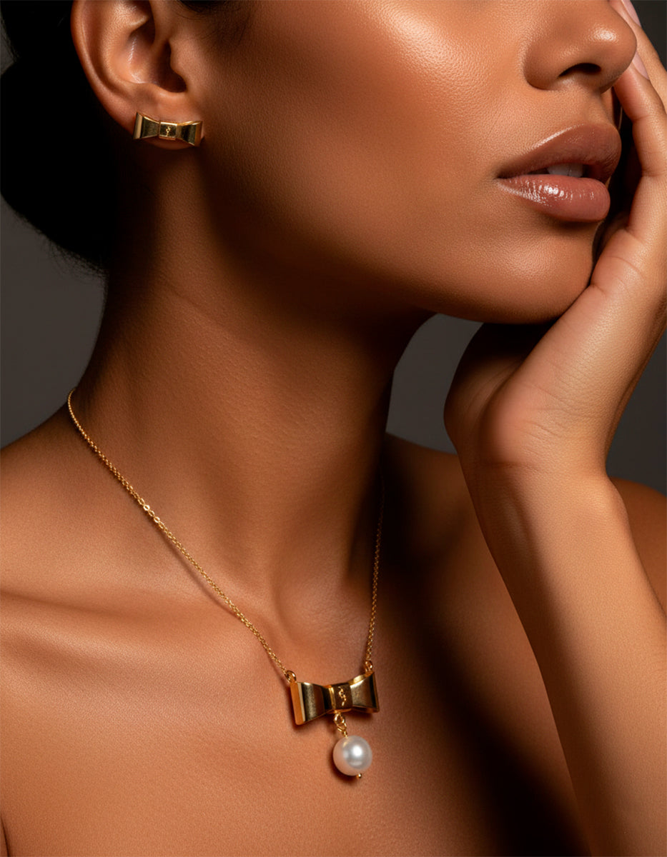 Set de Collar y aretes de moño con perla mabe